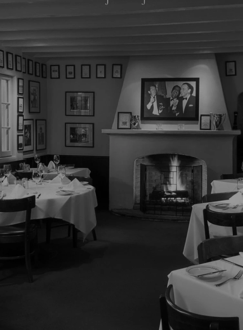 Lucky's Steakhouse Montecito interior dining room with warm lighting and classic art
