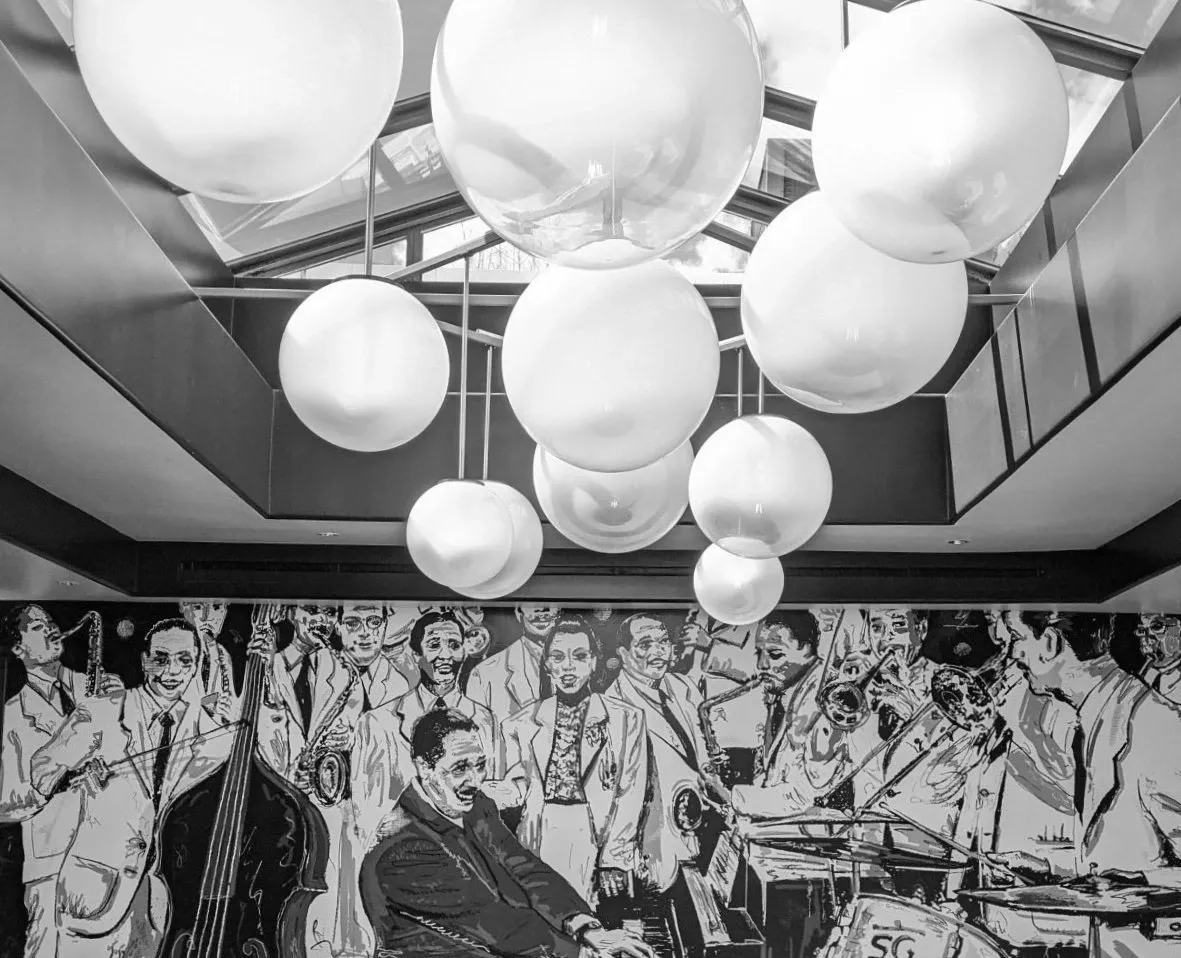 Historic photograph featuring Lucky's Steakhouse founders Gene Montesano and Jimmy Carter sharing a moment in the original Montecito dining room