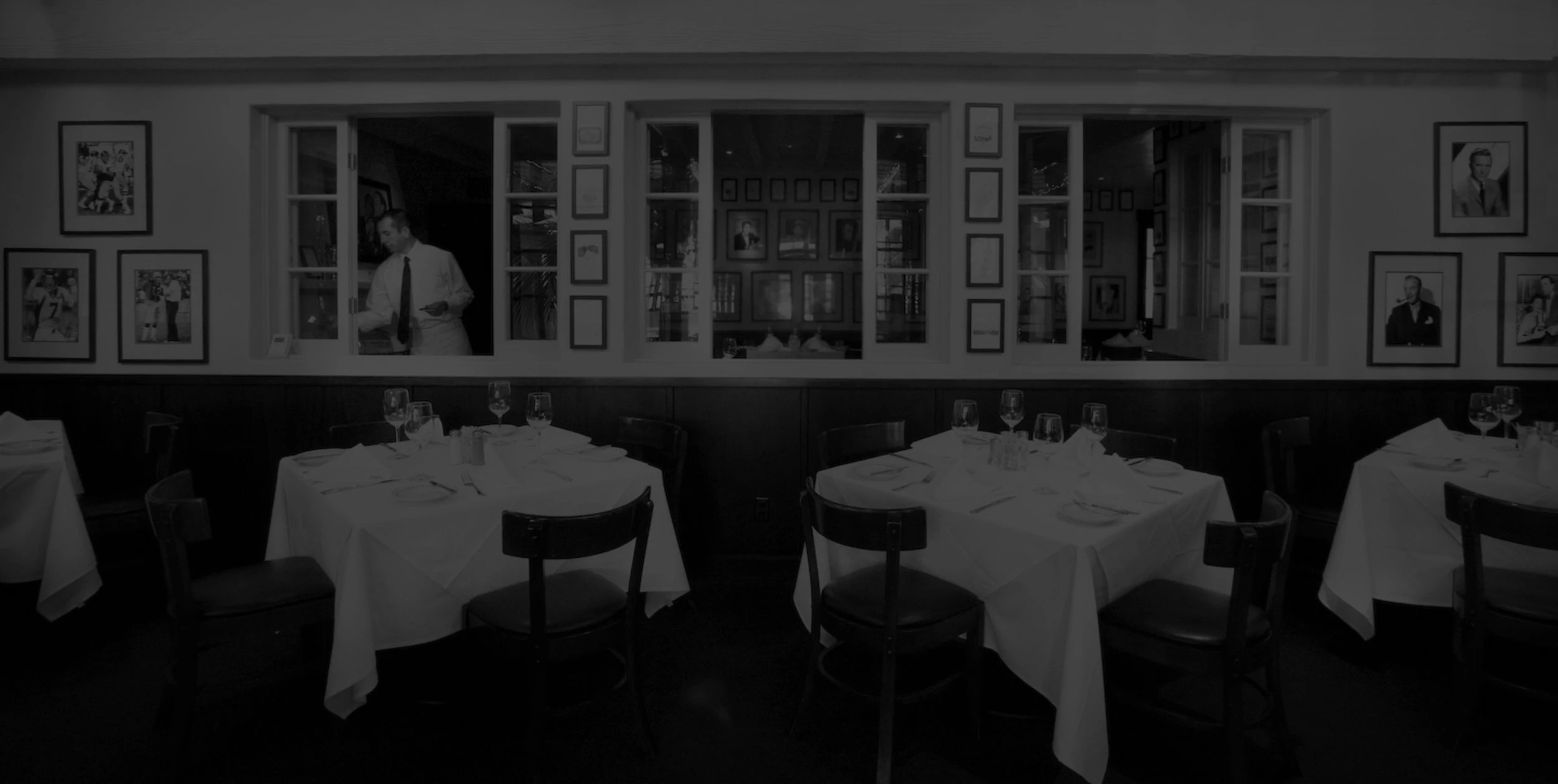 Overhead view of Lucky's Steakhouse ceiling with vintage globe lights and classic steakhouse ambiance