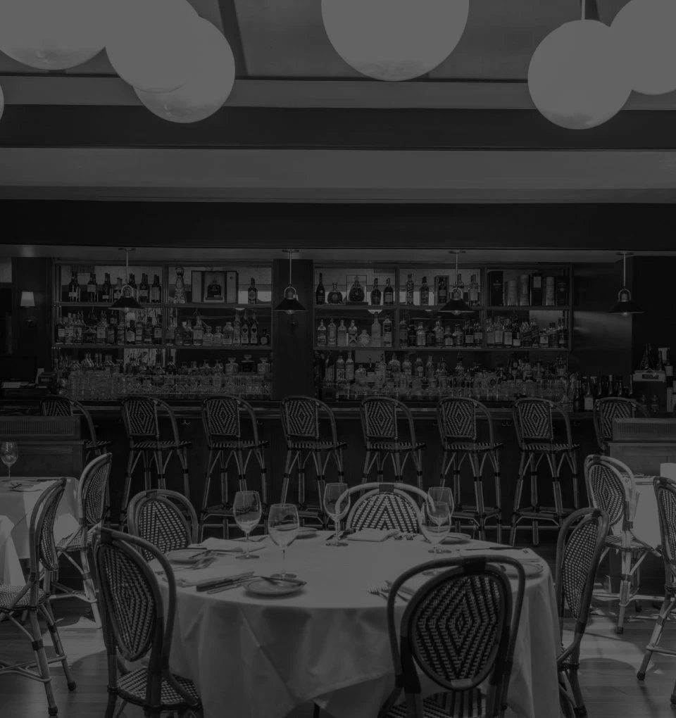 Interior of Lucky's Steakhouse Malibu location featuring bright coastal elegance mixed with traditional steakhouse architecture